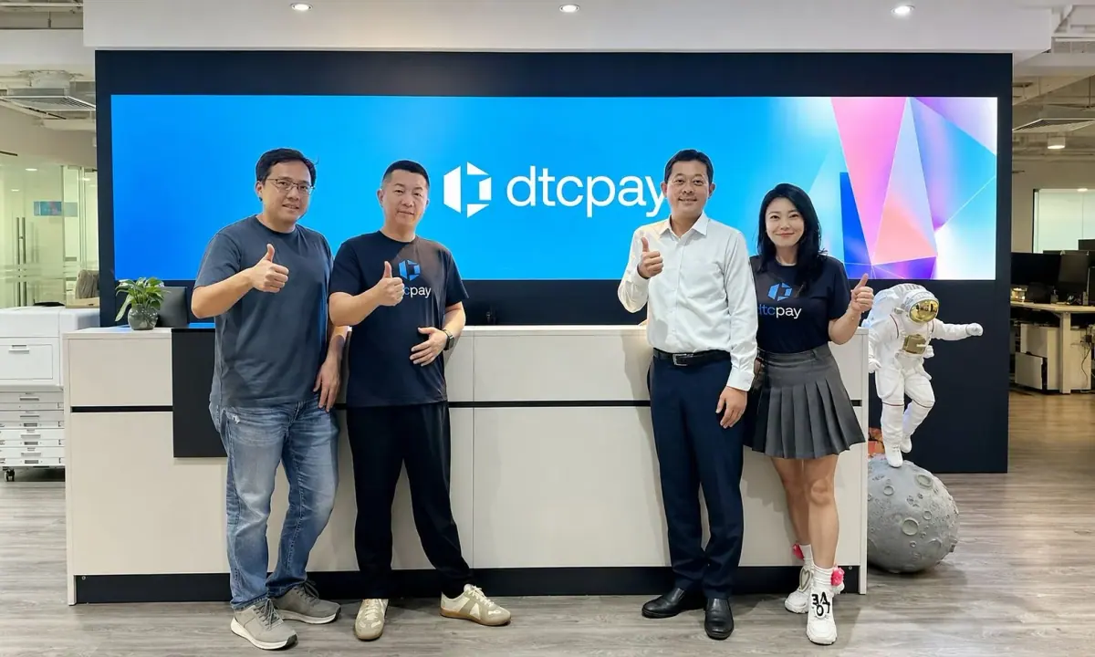People pictured in a dtcpay photograph supplied with the company’s PR Newswire release.