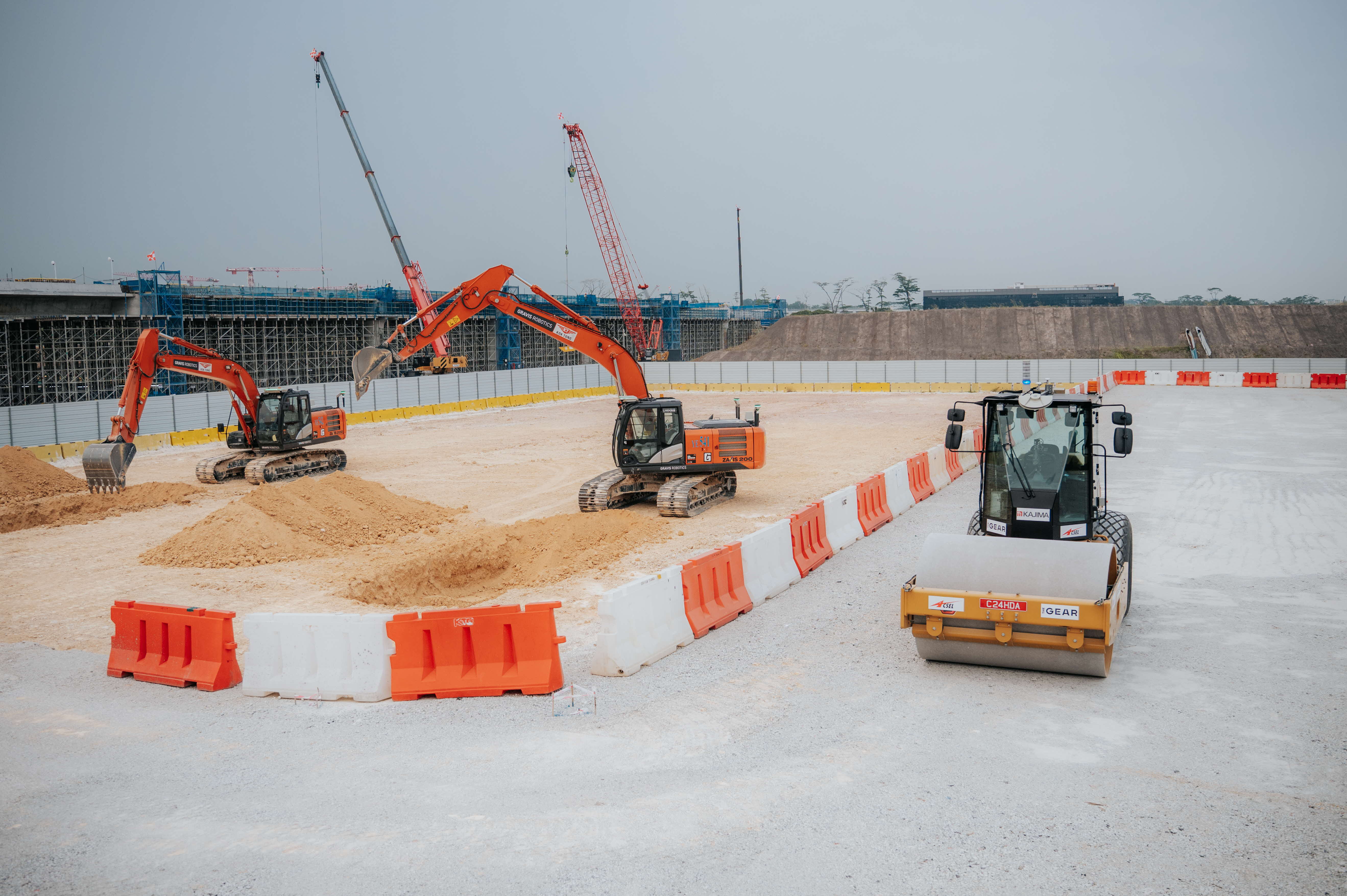 Autonomous construction equipment at the JTC and Kajima pilot in Singapore.