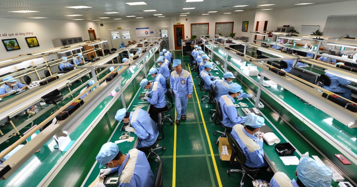 Workers assembling electronic components in Vietnam.