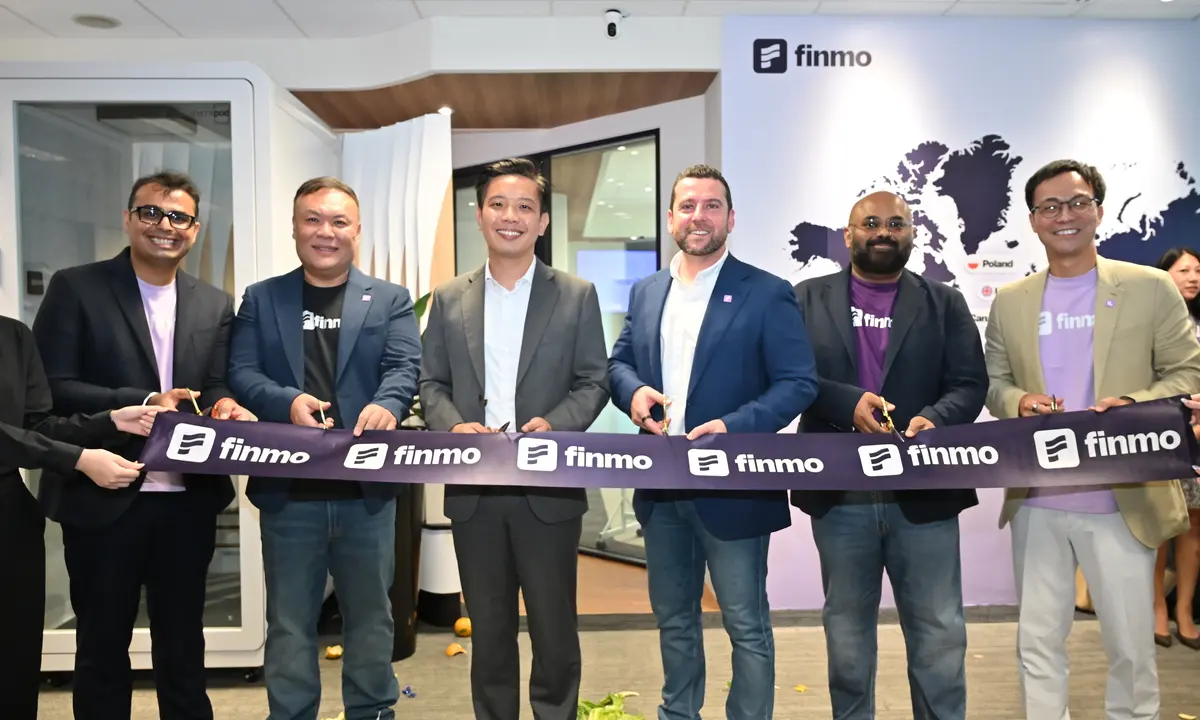 Conceptual Finmo headquarters at Suntec City with treasury operations displays.